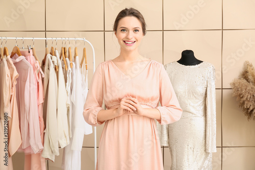 Female stylist near mannequ...