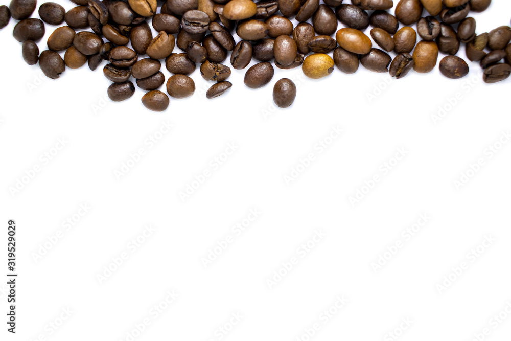 Coffee beans background, roasted coffee beans on a white background, space for text. Coffee beans background, roasted coffee beans on a white background, space for text.