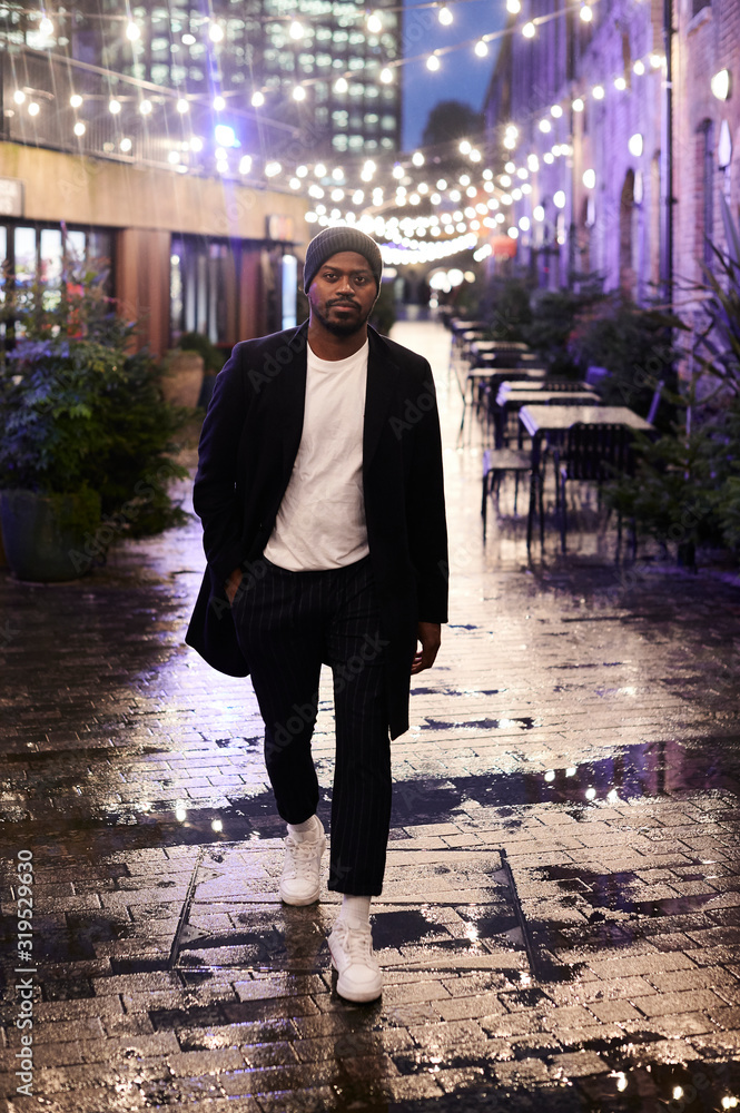 Portrait of stylish man in the city at night, London, UK Portrait of stylish man in the city at night, London, UK