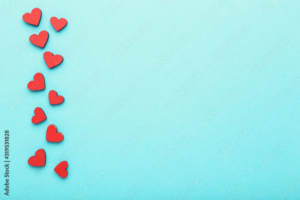 Red wooden hearts on blue background Red wooden hearts on blue background
