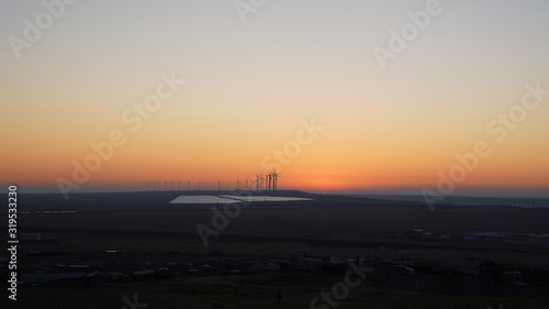 Mongolian sunrise with wind turbans