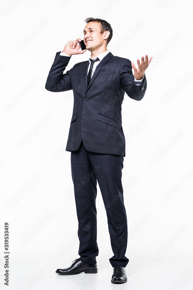 Young businessman walking and talking on phone on white background Young businessman walking and talking on phone on white background