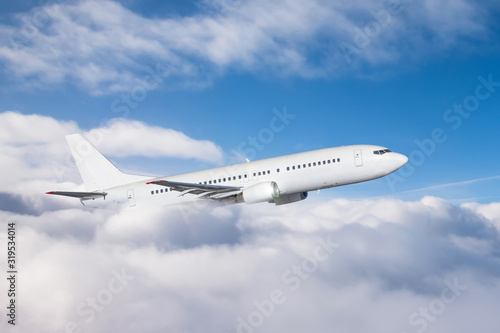 The plane gains altitude flying through a dense layer of clouds, travel flight.