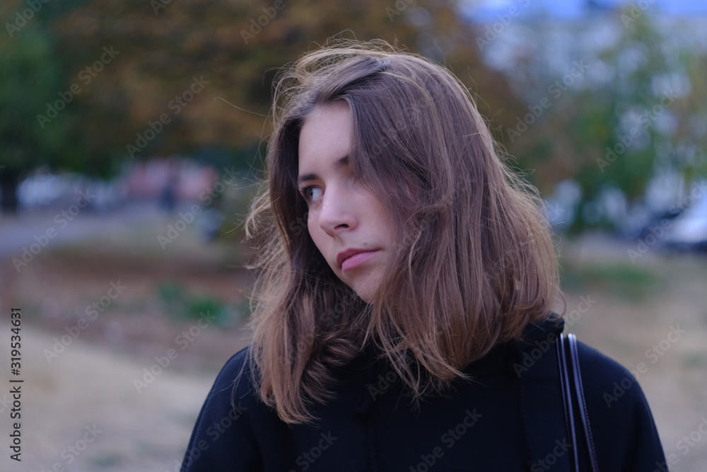 Young woman alone in an old city street Young woman alone in an old city street