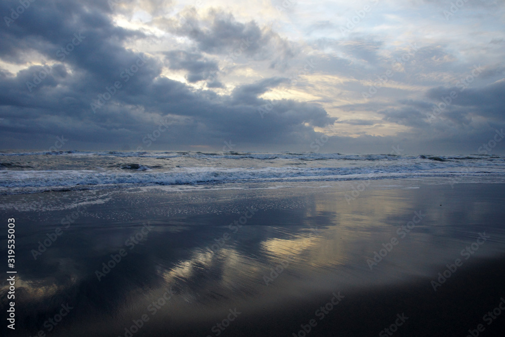 clouds reflected on the shore