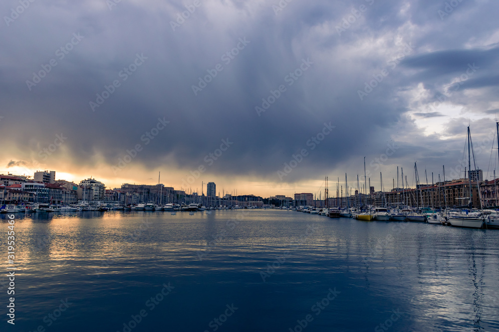 The sunset at the Vieux Port (Old Port) of Marseille on a cloudy day(January 25, 2020)