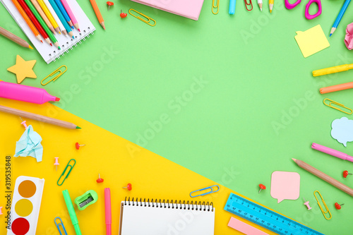 Different school supplies on colorful background