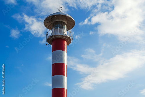 lighthouse on background of blue sky