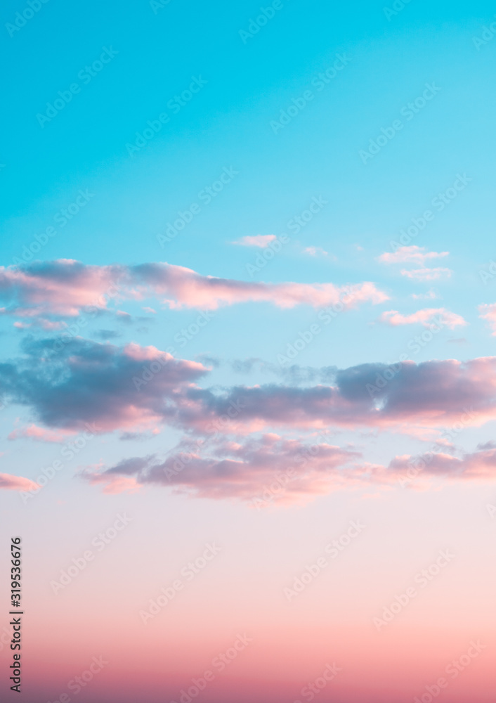 Pink clouds in the blue sky. Evening. Sunset. Pink clouds in the blue sky. Evening. Sunset.
