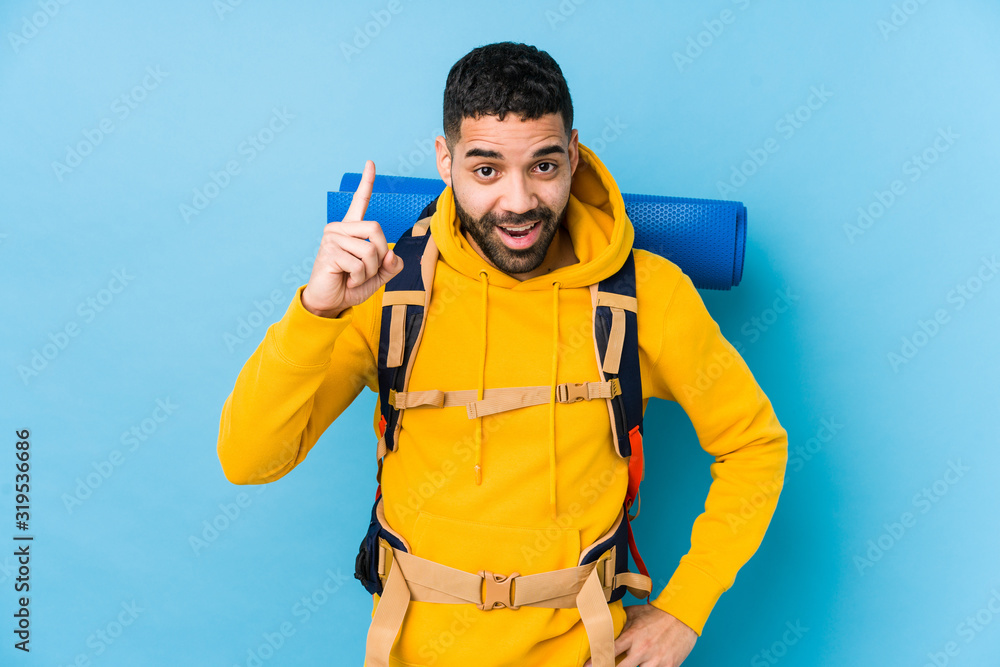 Young arabian traveler backpacker man isolated having an idea, inspiration concept. Young arabian traveler backpacker man isolated having an idea, inspiration concept.