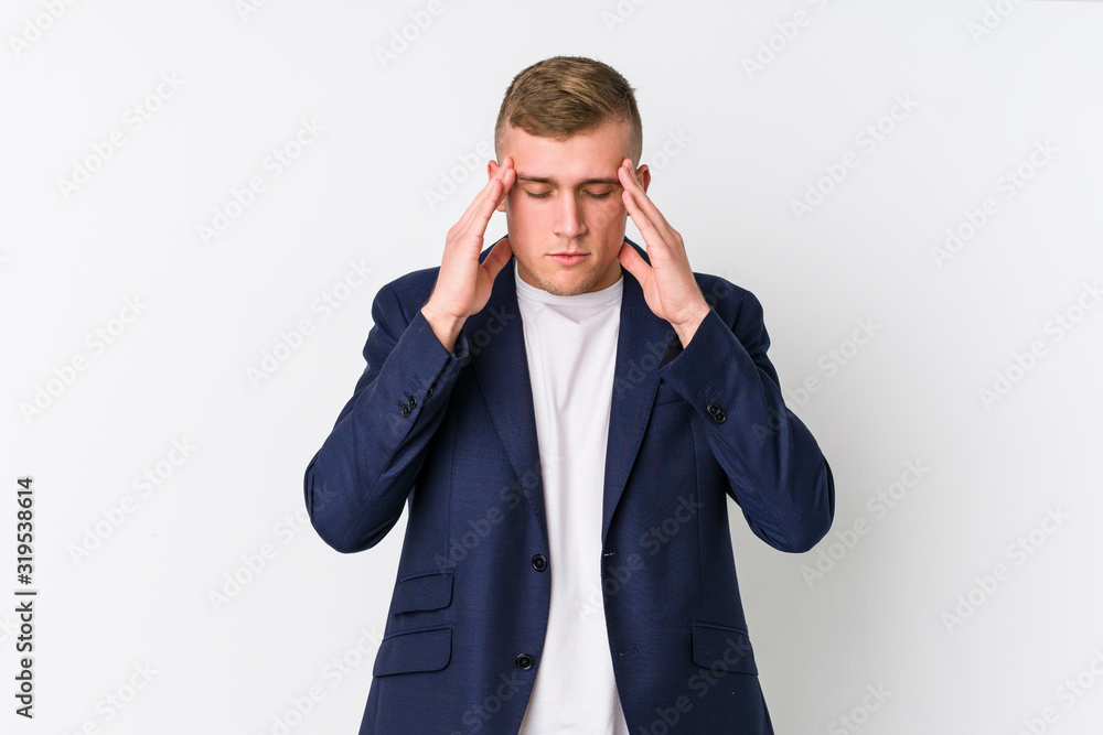 Young business caucasian man touching temples and having headache. Young business caucasian man touching temples and having headache.