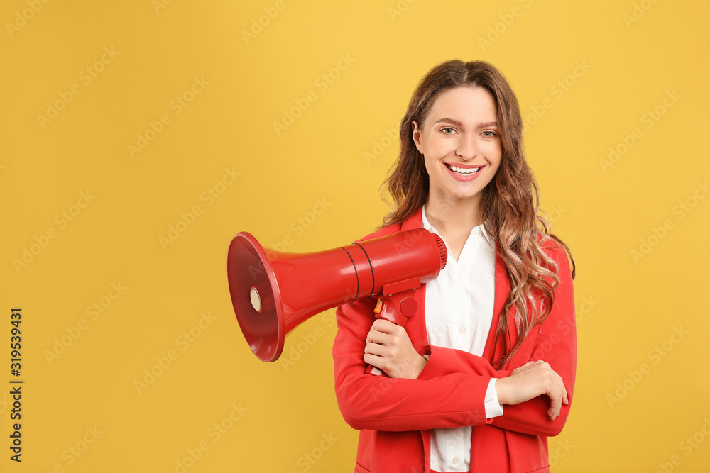 Young woman with megaphone on yellow background Young woman with megaphone on yellow background