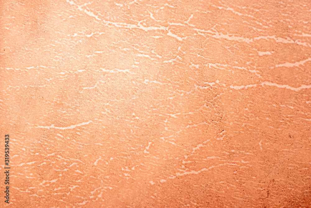 Fototapeta premium A dirty grunge background pattern made from backlit natural leather with thin cracks throughout the subsurface.