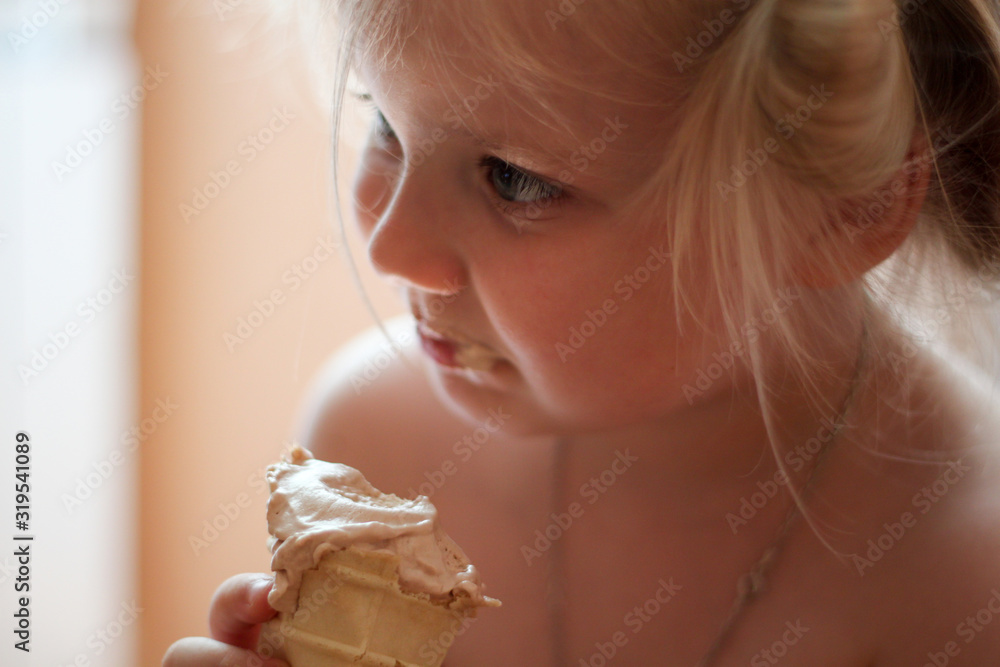 the girl eats ice cream
