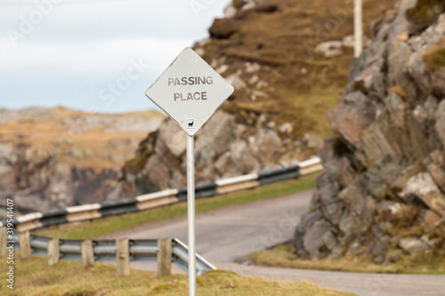 Passing place signpost on the NC500 route in the Scottish highlands