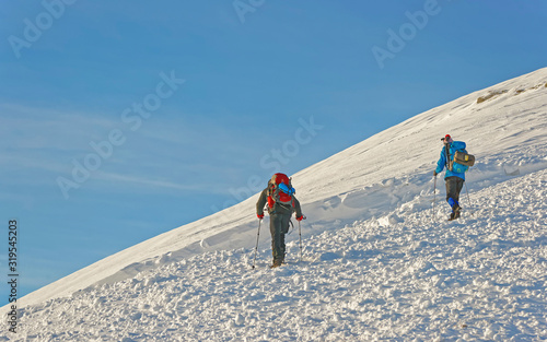 People climbing at the top of Kasprowy Wierch in Zakopane in winter. Zakopane is a town in Poland in Tatra Mountains. Kasprowy Wierch is a mountain in Zakopane and the most popular ski area in Poland
