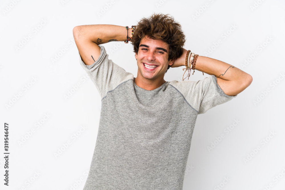 Young caucasian man against a white background isolated stretching arms, relaxed position. Young caucasian man against a white background isolated stretching arms, relaxed position.