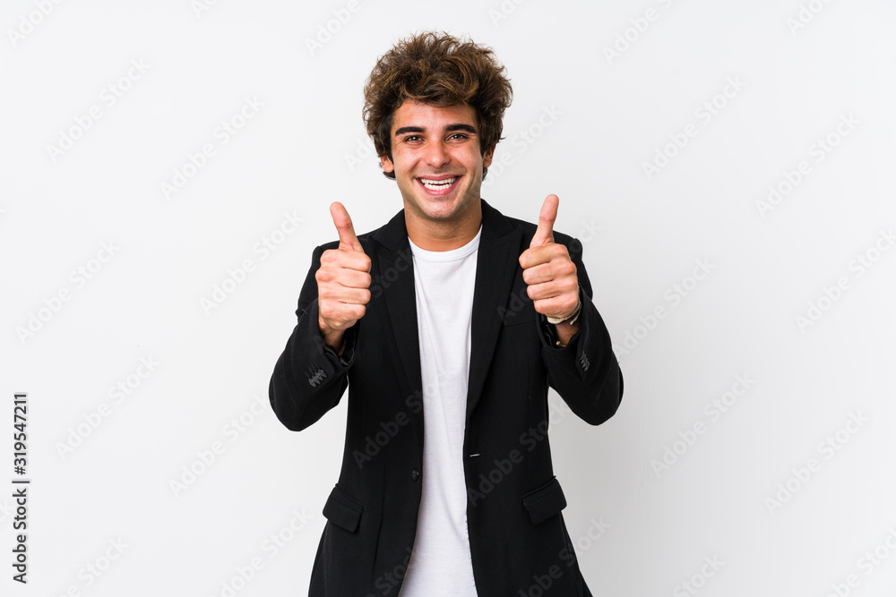 Young caucasian business man against a white background isolated with thumbs ups, cheers about something, support and respect concept. Young caucasian business man against a white background isolated with thumbs ups, cheers about something, support and respect concept.
