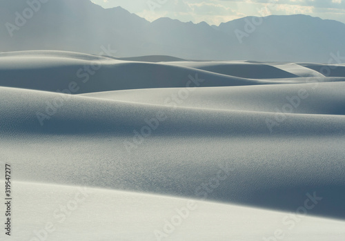 Wide view of undulating white dune field at White Sands National Park