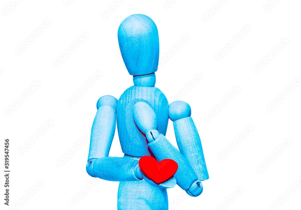 Wooden dummy holds a red heart. Valentine's day concept. Concept of protecting health from heart disease. Wooden dummy holds a red heart. Valentine's day concept. Concept of protecting health from heart disease.