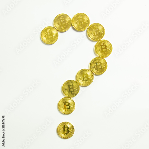Bitcoin coins that are laid out like a question mark and isolated on white, cryptocurrency what to do or what it would be etc. concept.
