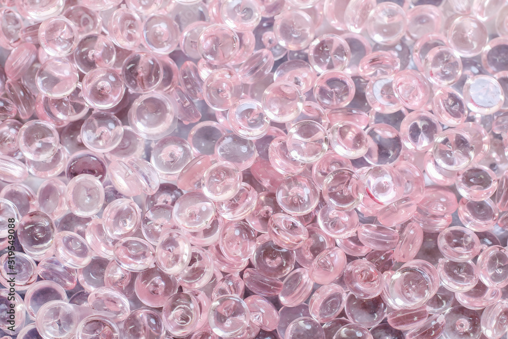 Pink background made of transparent crystals. Pink background made of transparent crystals.