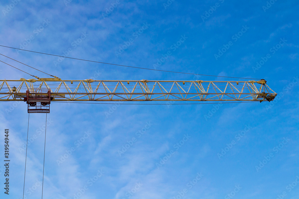 Construction cranes and blue sky Construction cranes and blue sky
