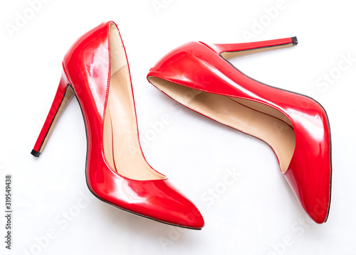 Konstfotografi female shiny red stilettos on a white background