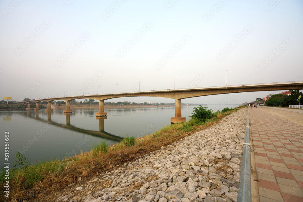 Fototapeta premium Udon Thani,Thailand-January 23, 2020: First Thai–Lao Friendship Bridge viewed from Nong Khai, Thailand