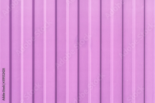 Brightly lilac painted sheet of corrugated metal. Abstract background for sites and layouts.