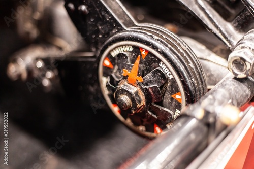 gauge on steering wheel of classic car photo