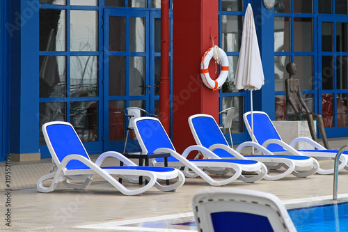 Принти на полотні Deck chairs swimming pool