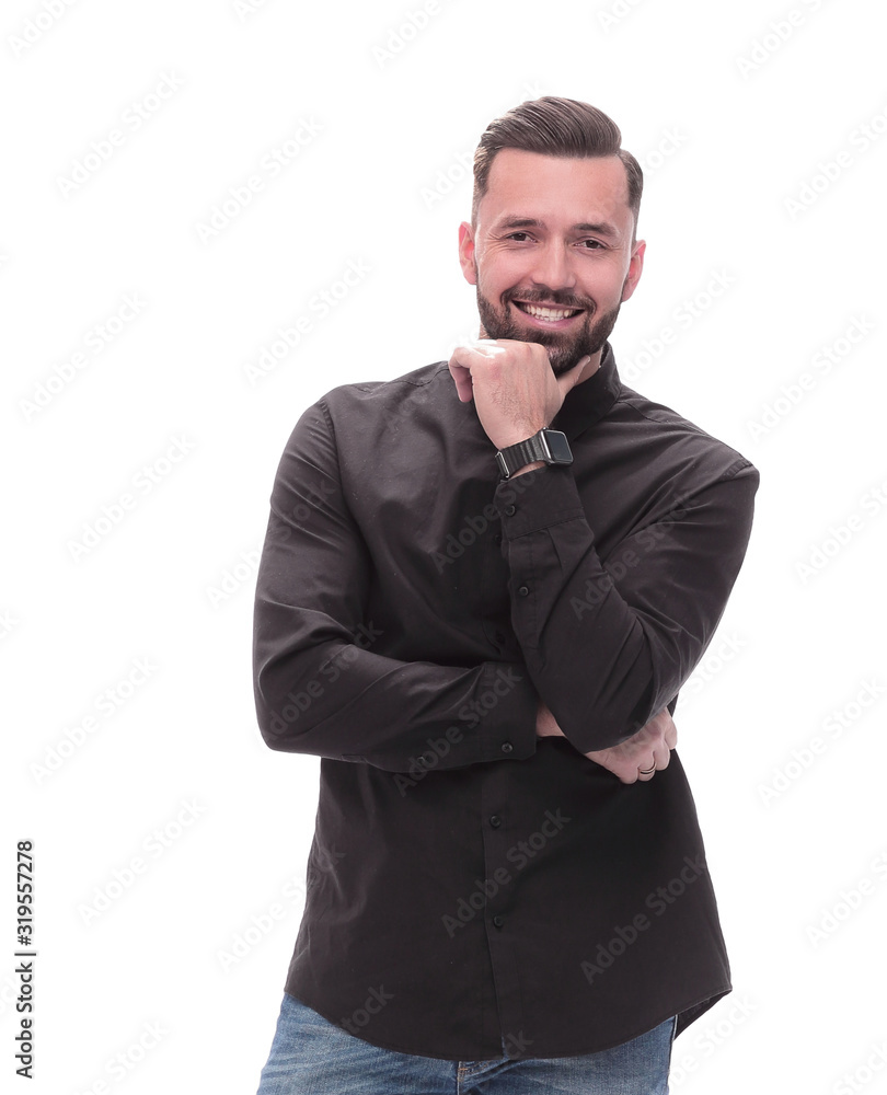 in full growth. smiling young man in jeans in full growth. smiling young man in jeans