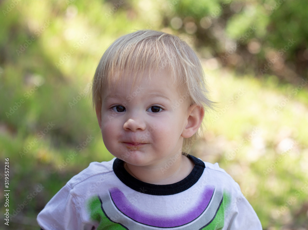 Young 2 Year Old Boy Playing Outside At A State Park Stock Photo young-2-year-old-boy-playing-outside-at-a-state-park-stock-photo