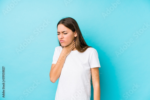 Young caucasian woman  isolated suffers pain in throat due a virus or infection.