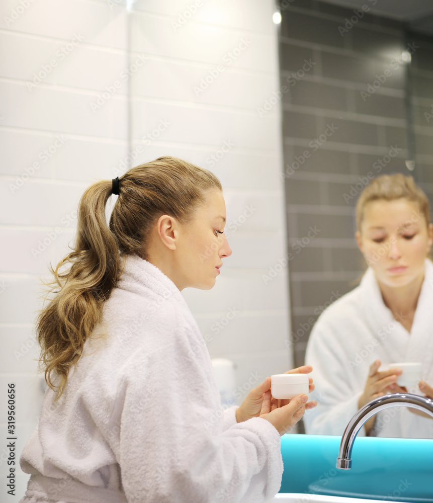 Magic anti-aging cream.Applying the cream Magic anti-aging cream.Applying the cream