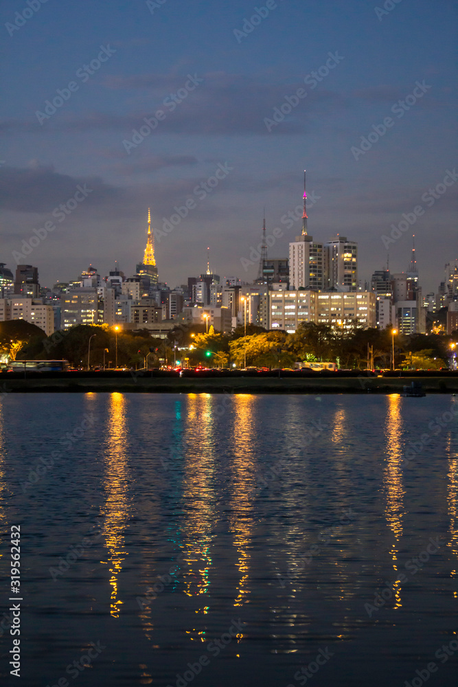 Sao Paulo, Brazil, August 13, 2013. Night view lake in Ibirapuera Park and Sky line of city in Sao Paulo