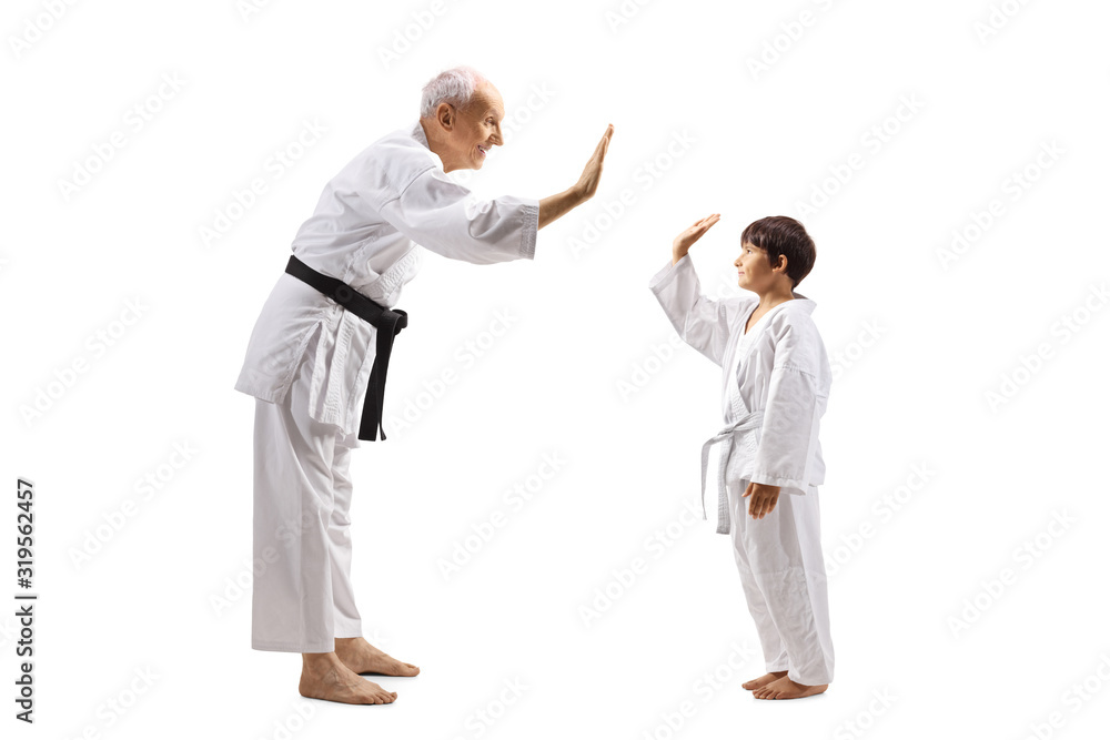 Karate boy and an elderly man gesturing high-five