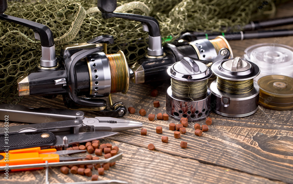 Spinning and fishing rods on an old background Spinning and fishing rods on an old background