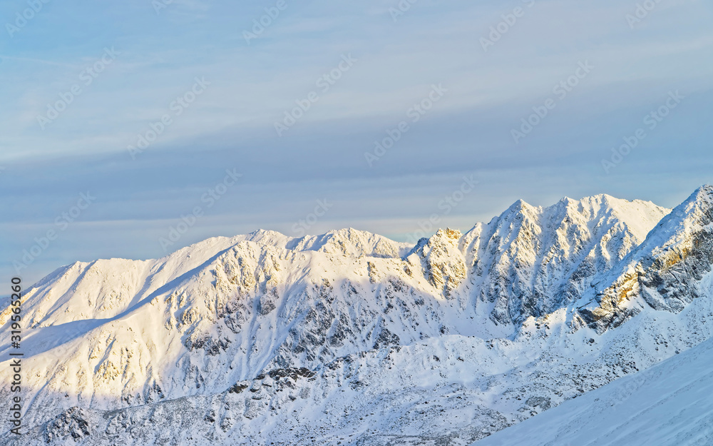 Obraz premium Sunny weather in Kasprowy Wierch in Zakopane in Tatra Mounts in winter. Zakopane is a town in Poland in Tatra Mountains. Kasprowy Wierch is a mount in Zakopane and the most popular ski area in Poland