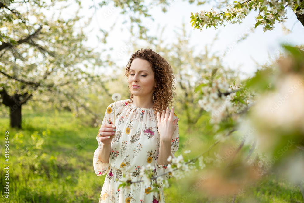 Pretty girl blowing dandelion in summer park. Green grass beautiful nature. Pure emotion. Pretty girl blowing dandelion in summer park. Green grass beautiful nature. Pure emotion.