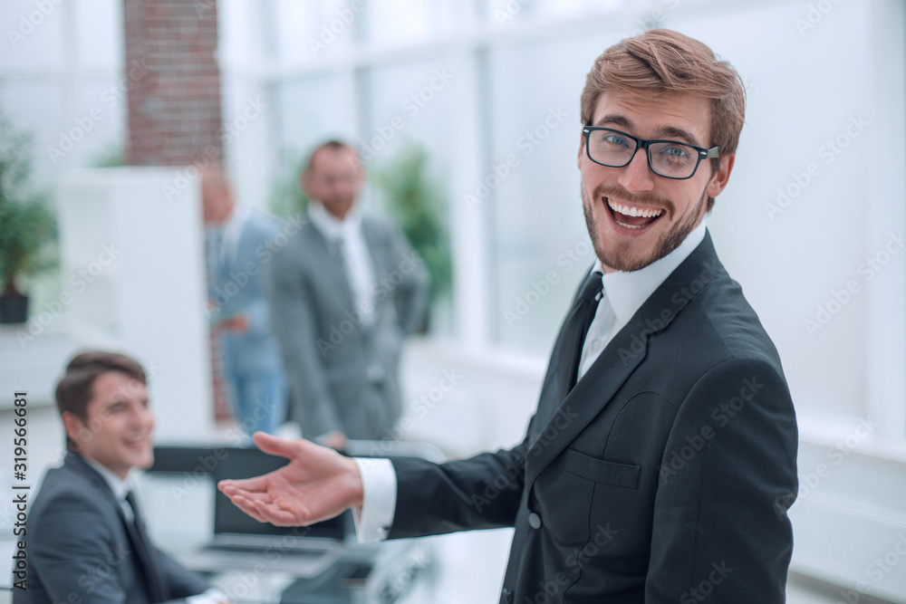 close up. smiling friendly businessman standing in the office close up. smiling friendly businessman standing in the office