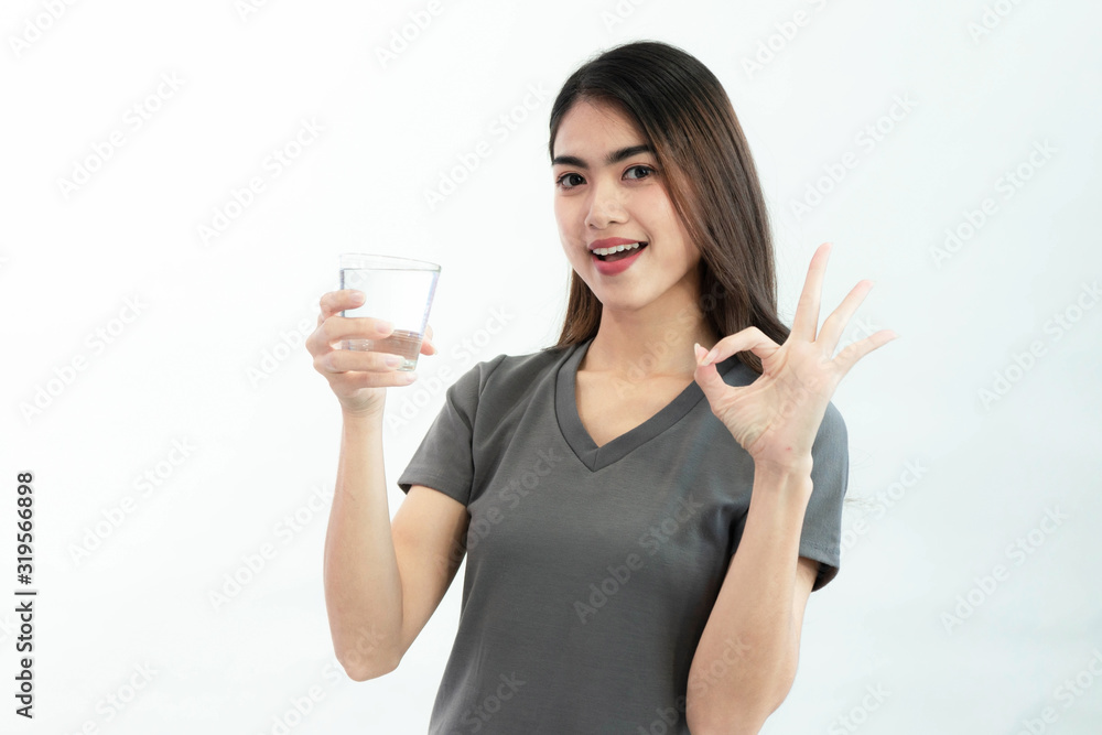 Young woman drink water isolated on white background Young woman drink water isolated on white background
