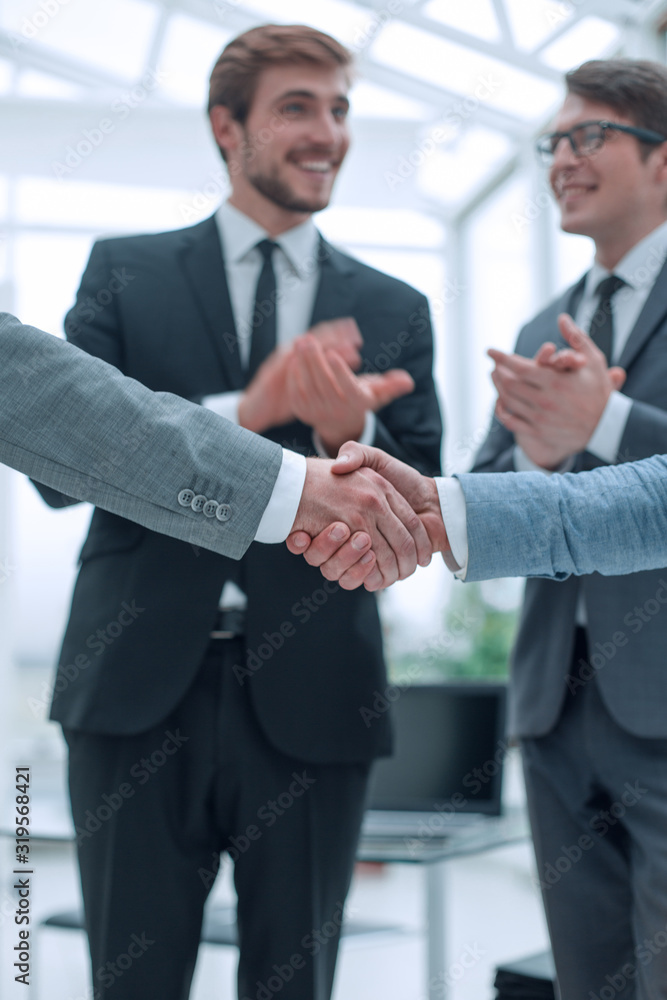 close up. business partners, confidently shaking hands close up. business partners, confidently shaking hands