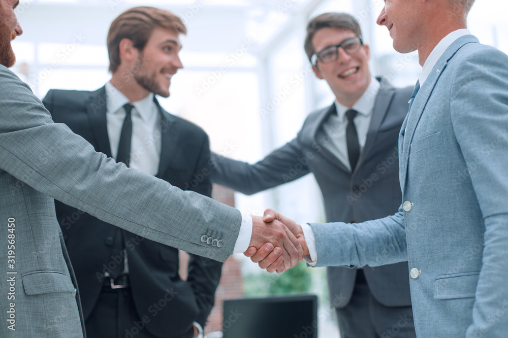welcome handshake of business people in the office welcome handshake of business people in the office