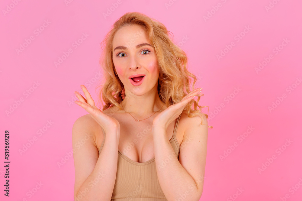 Gorgeous young blonde posing on a bright background Gorgeous young blonde posing on a bright background