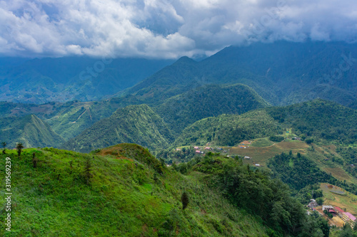 cenery of Cat Cat village, popular tourist trekking destination. Rice field terraces. Mountain view in the clouds. Sapa, Lao Cai Province, north-west Vietnam.