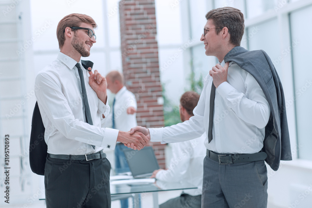 business people shaking hands with each other when meeting in the office. business people shaking hands with each other when meeting in the office.