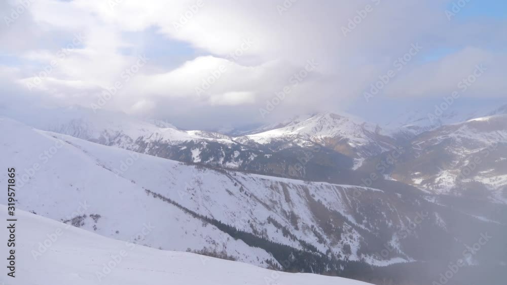 Snow covered beautiful mountain peaks against the blue sky. Snow covered beautiful mountain peaks against the blue sky.