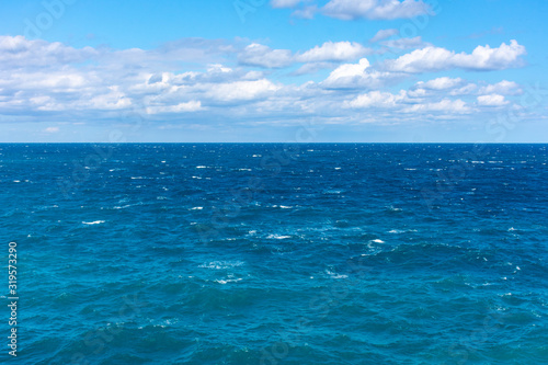 View of a rough sea with blue sky